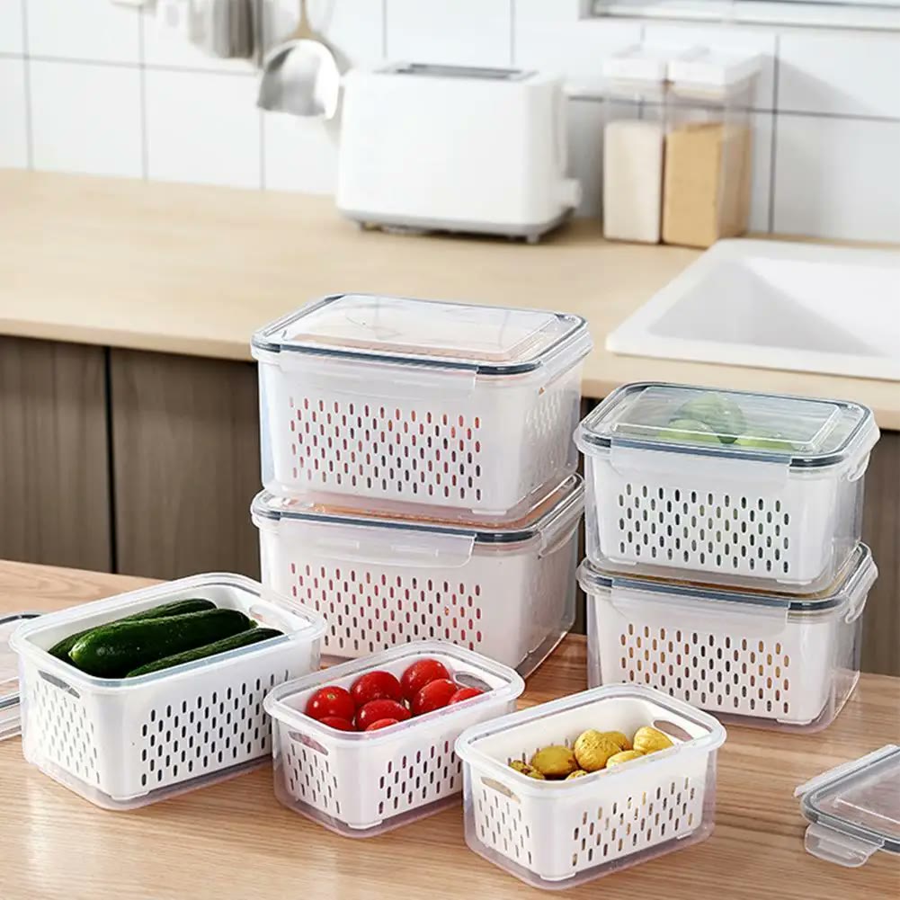Seven keepers on a kitchen counter holding cucumbers, cherry tomatoes and potatoes, showing the range of sizes