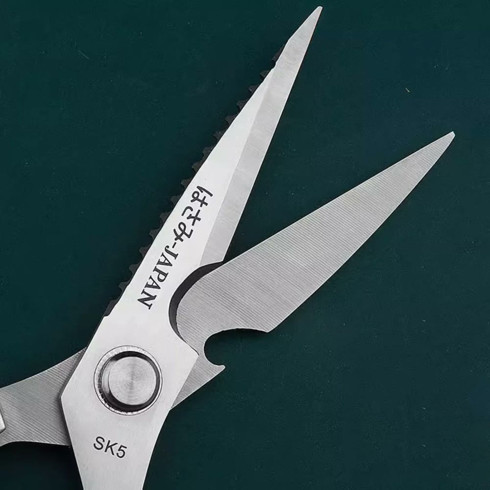 Close-up of the two blades apart, showing the serration, the bottle-opener notch and the SK5 stamp