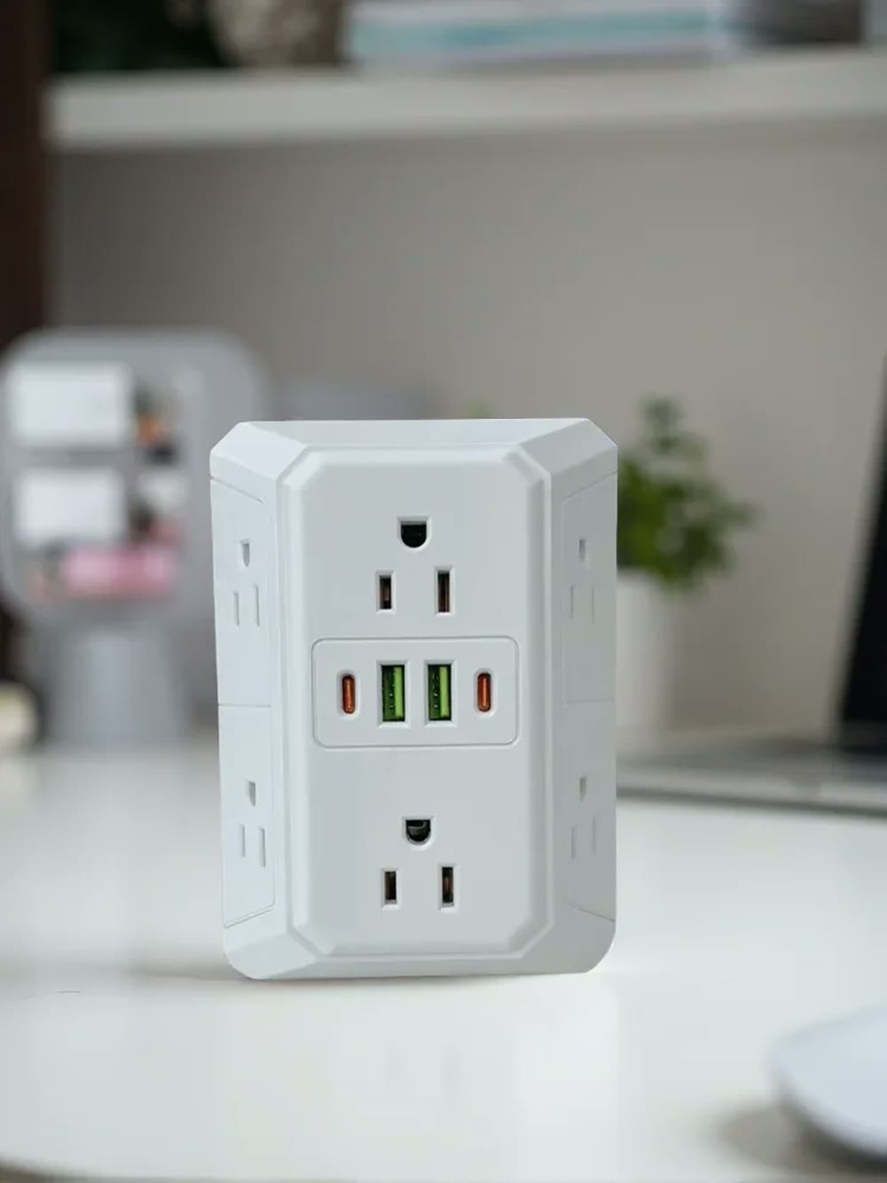 The white extender on a worktop, showing its depth and the recessed side sockets